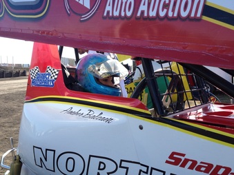 Amber Balcaen getting strapped in. Photo By: Rick Rea - River Cities Speedway